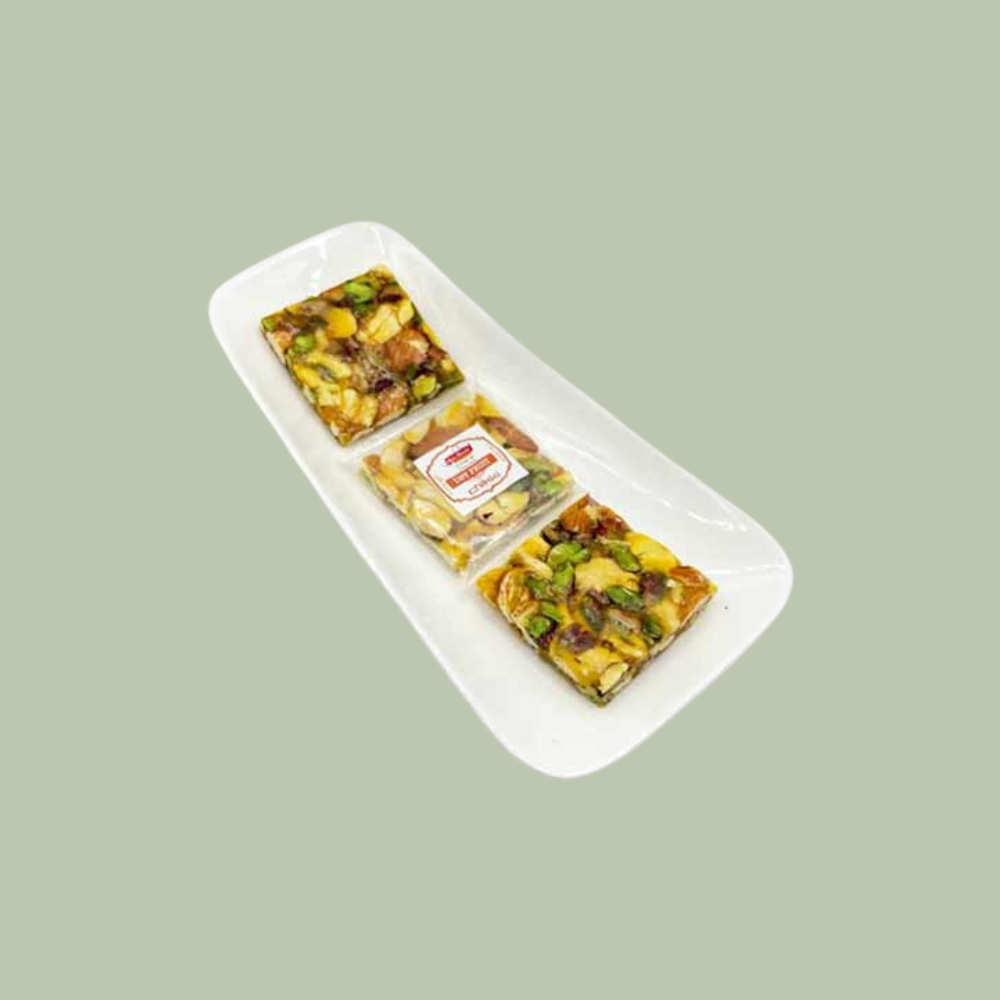 https://cdn.shopify.com/s/files/1/1857/6931/files/DryFruitChikki.png?v=1784886931