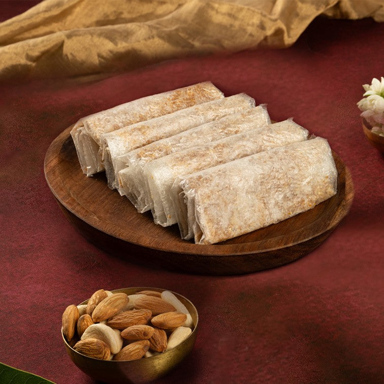 https://cdn.shopify.com/s/files/1/1857/6931/files/Dry_Fruit_Pootharekulu_1.jpg?v=1747736697