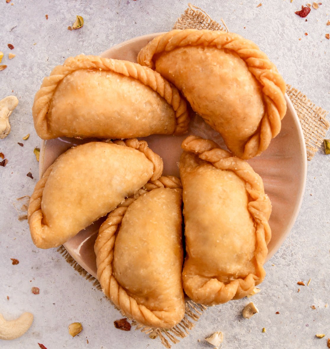 https://cdn.shopify.com/s/files/1/1857/6931/files/gujiya-864525.jpg?v=1762168818