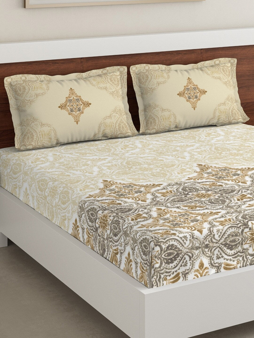 https://cdn.shopify.com/s/files/1/1857/6931/products/0cbb6a34-cda8-44a7-9d1d-691a770c32321644433043653DDecorBeigeGreyEthnicMotifs180TCCotton1KingBedsheetwith2Pill2.jpg?v=1703244577