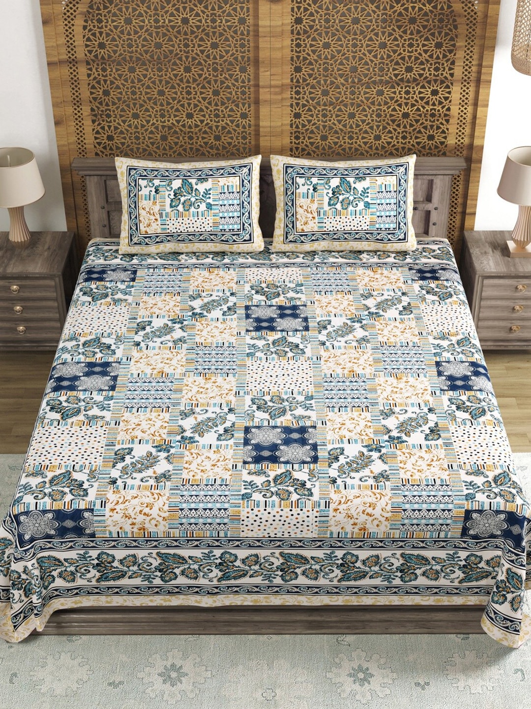 https://cdn.shopify.com/s/files/1/1857/6931/products/0dc7b96c-23b3-4984-a702-28b6ab161de31689995146375SangriaBlueBrownPrinted210TCCottonDoubleKingBedsheetWithPill2.jpg?v=1703310142