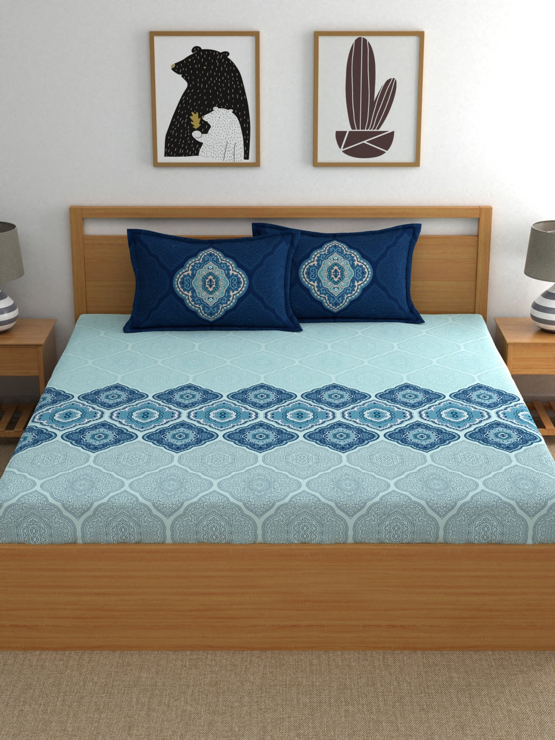 https://cdn.shopify.com/s/files/1/1857/6931/products/101a1dab-8e4a-4982-9063-de89fa40d6a11673503427366-Dreamscape-Blue-Ethnic-144-TC-Cotton-1-Queen-Bedsheet-with-2-2.jpg?v=1703314936