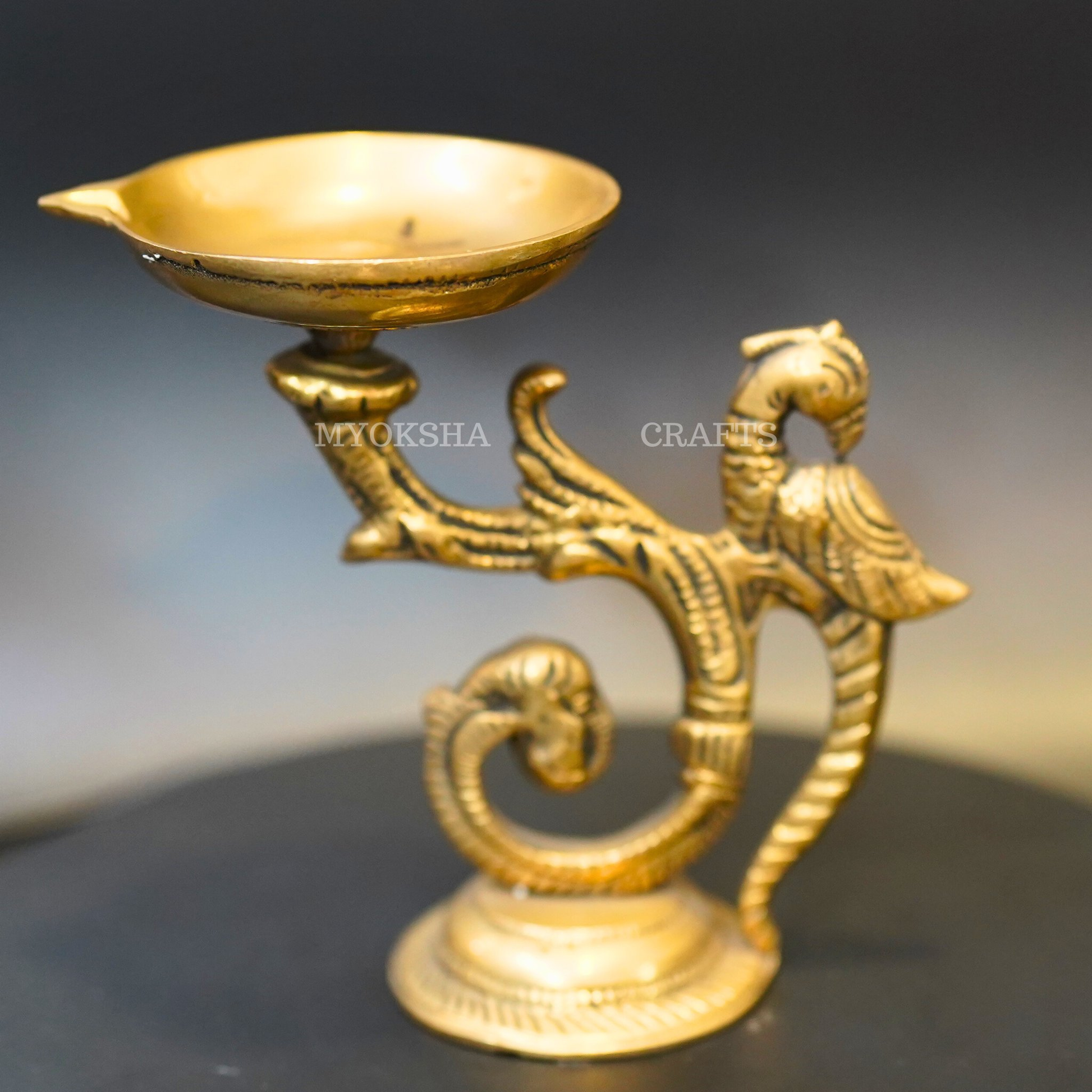 https://cdn.shopify.com/s/files/1/1857/6931/products/1692611156984_peacock_diya_MC00322.png?v=1753181960