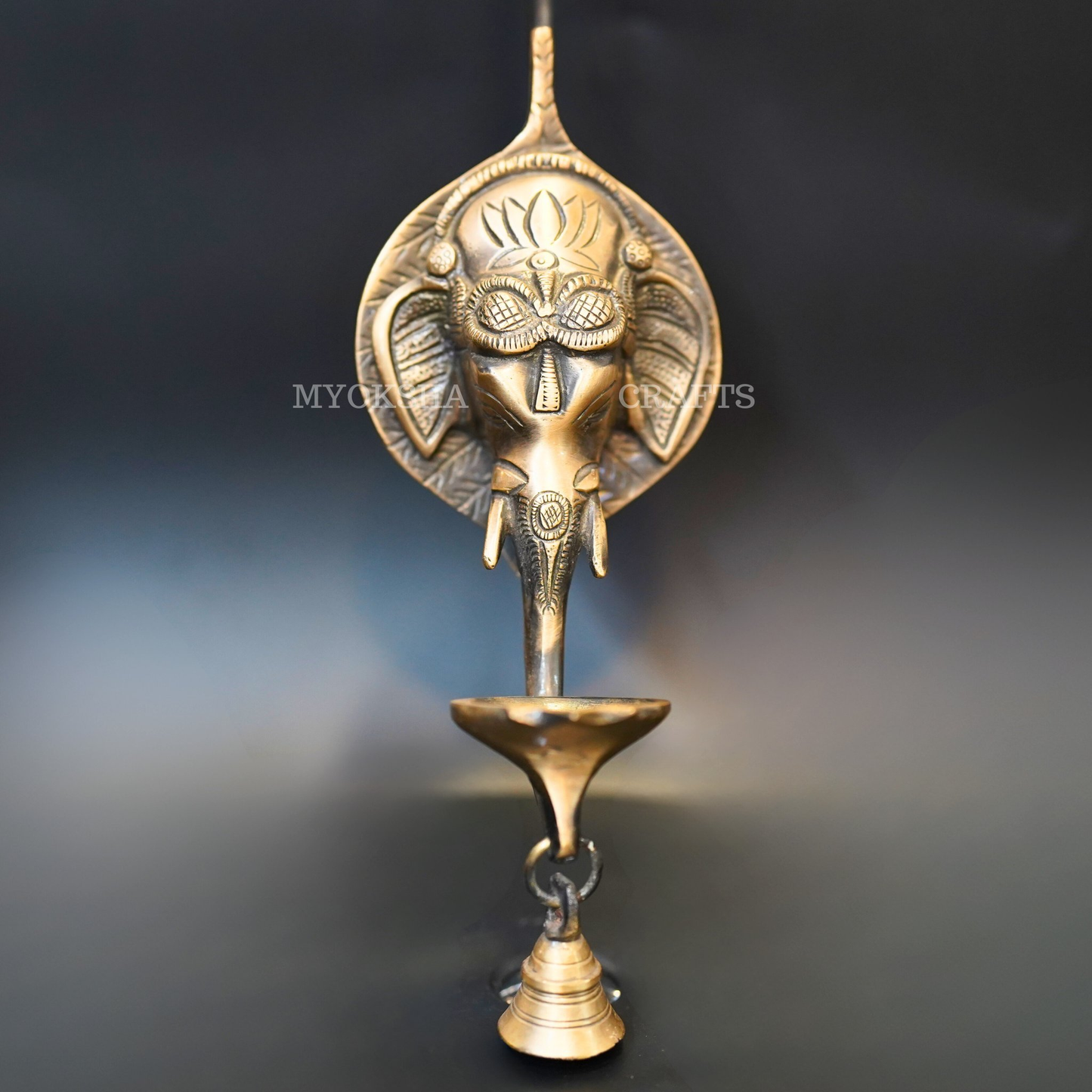 https://cdn.shopify.com/s/files/1/1857/6931/products/1692684396038_ganesha_wall_diya_MC00324.png?v=1753182648