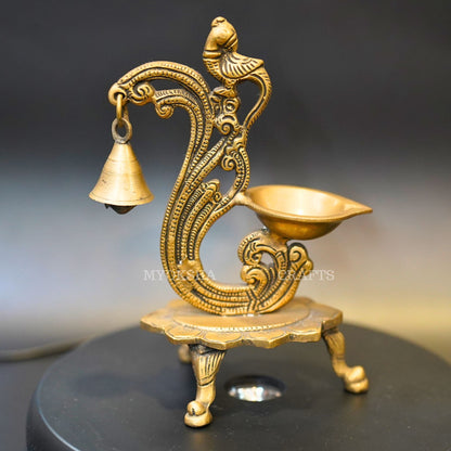 https://cdn.shopify.com/s/files/1/1857/6931/products/1692686978218_parrot_with_bell_diya_MC00329.png?v=1697290080