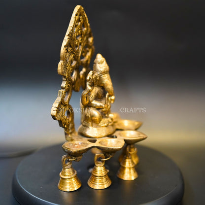 https://cdn.shopify.com/s/files/1/1857/6931/products/1692689128581_ganesha_5_oil_wick_vth_bells_diya_MC00331_282_29.png?v=1692946232