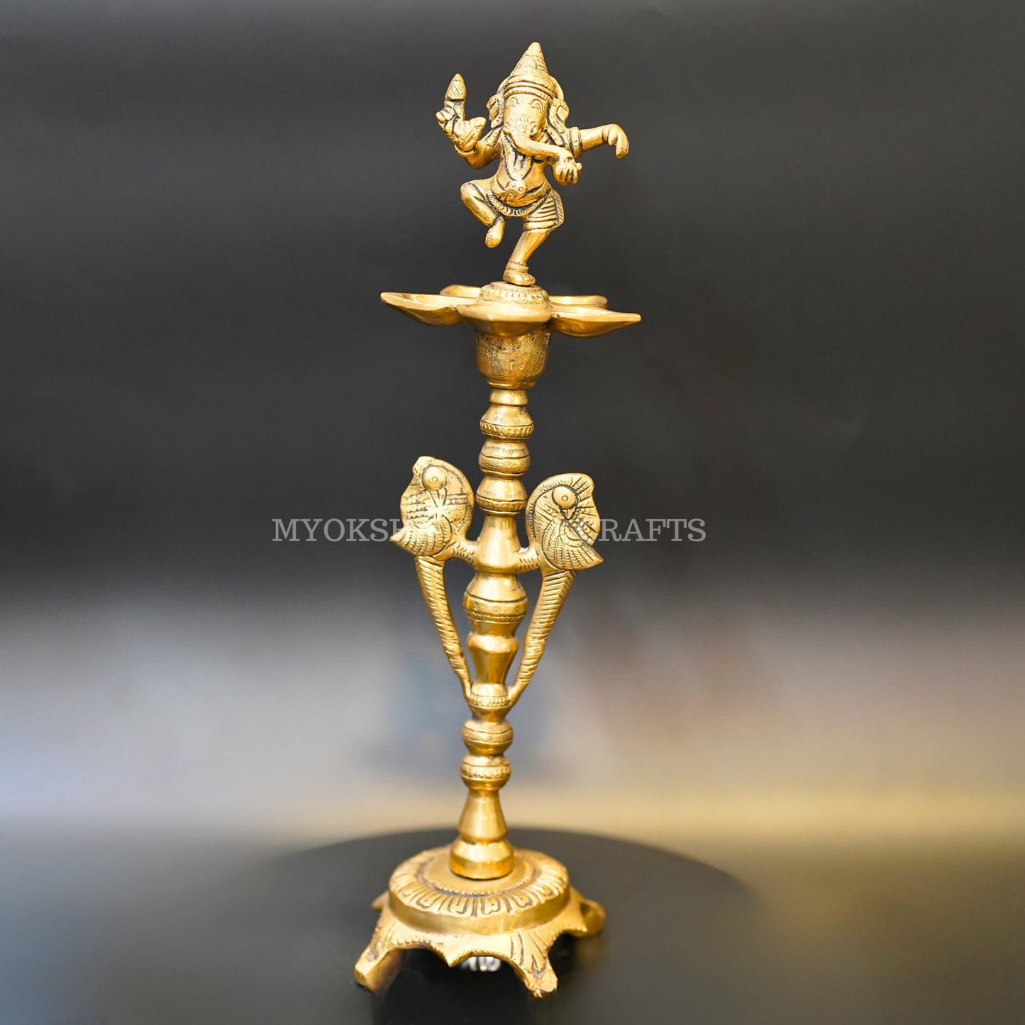 https://cdn.shopify.com/s/files/1/1857/6931/products/1692689869018_ganesha_diya_MC00332.png?v=1753182663