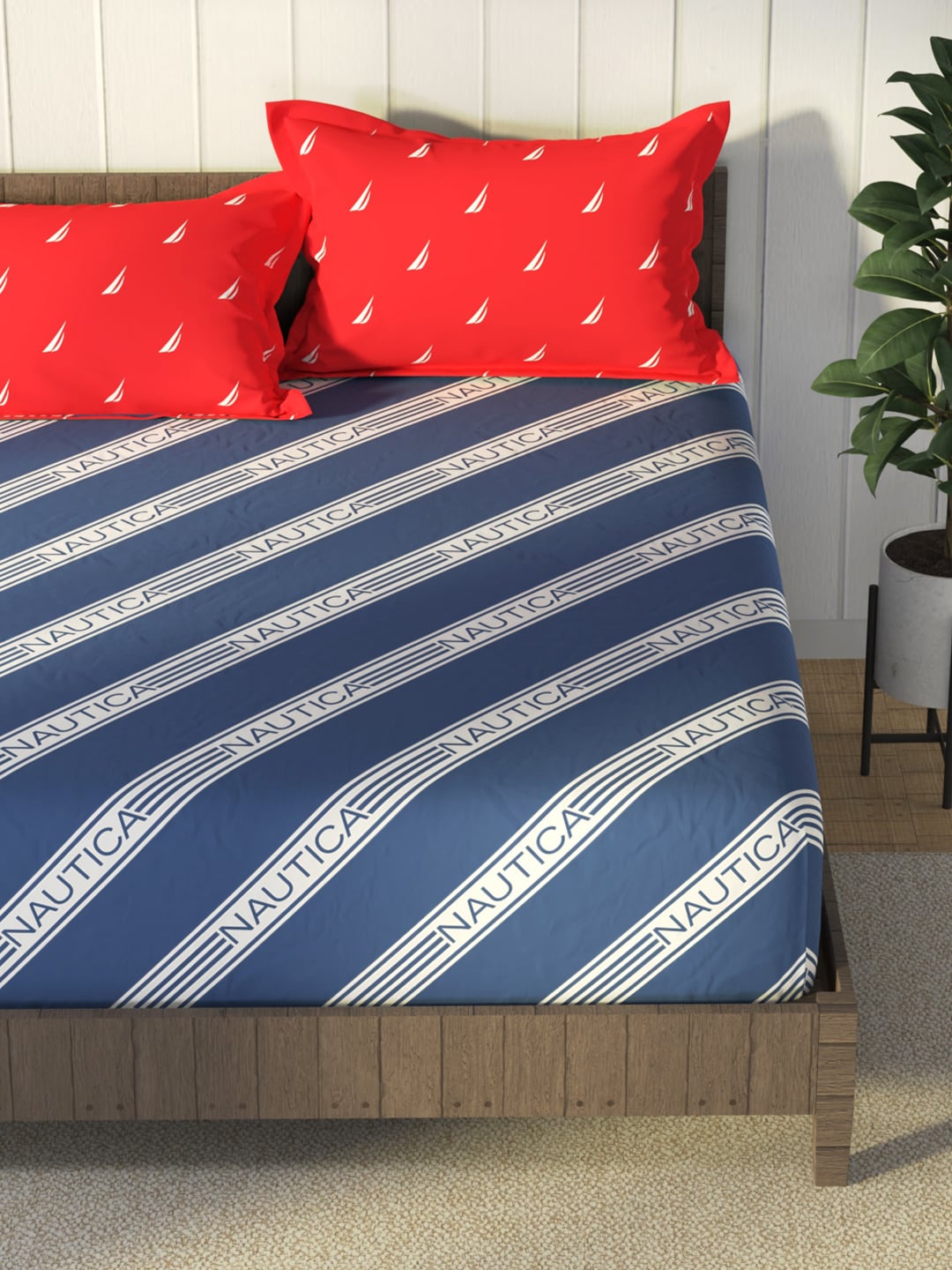 https://cdn.shopify.com/s/files/1/1857/6931/products/46c1eef8-cfe4-4ac1-9131-4318fb22e5a01683524352551NauticaBlueRedStripedCotton160TCKingBedsheetWith2PillowCover3.jpg?v=1703230045