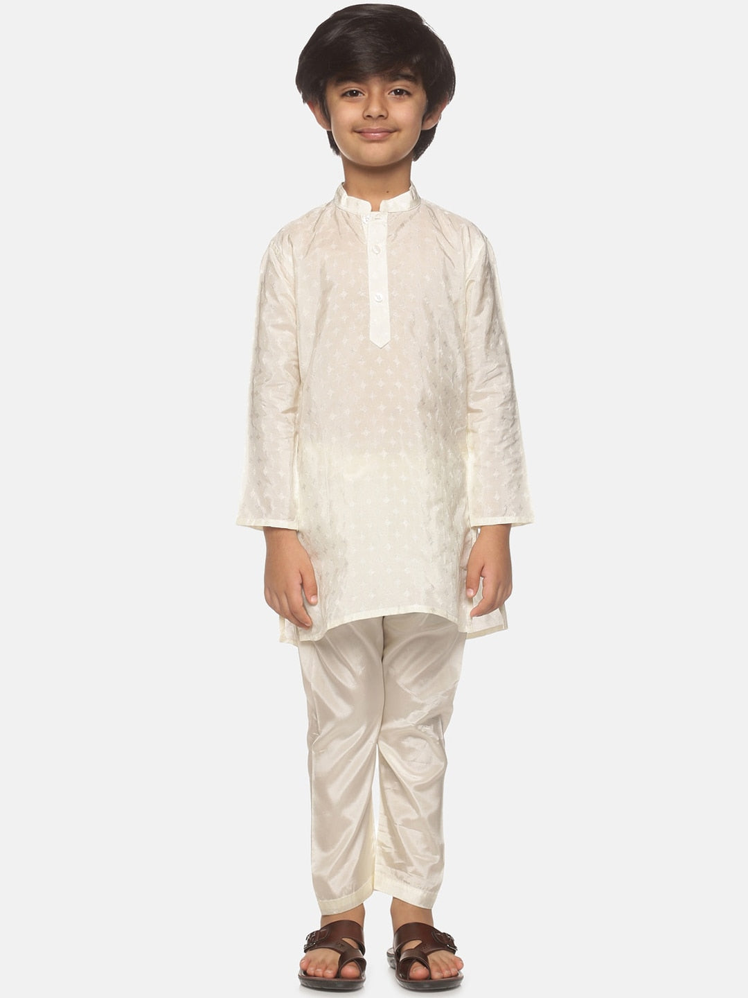 https://cdn.shopify.com/s/files/1/1857/6931/products/48e1ca08-fece-48b2-8052-796ce54676a41646226943696SethukrishnaBoysCream-ColouredKurtawithPyjamas1.jpg?v=1661576221