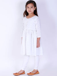 https://cdn.shopify.com/s/files/1/1857/6931/products/74c1e328-ec2e-4360-9536-a6c171f5b1a71657041592594VASTRAMAYGirlsWhiteDyedPleatedChikankariPureCottonKurtiwithD5.jpg?v=1661772127