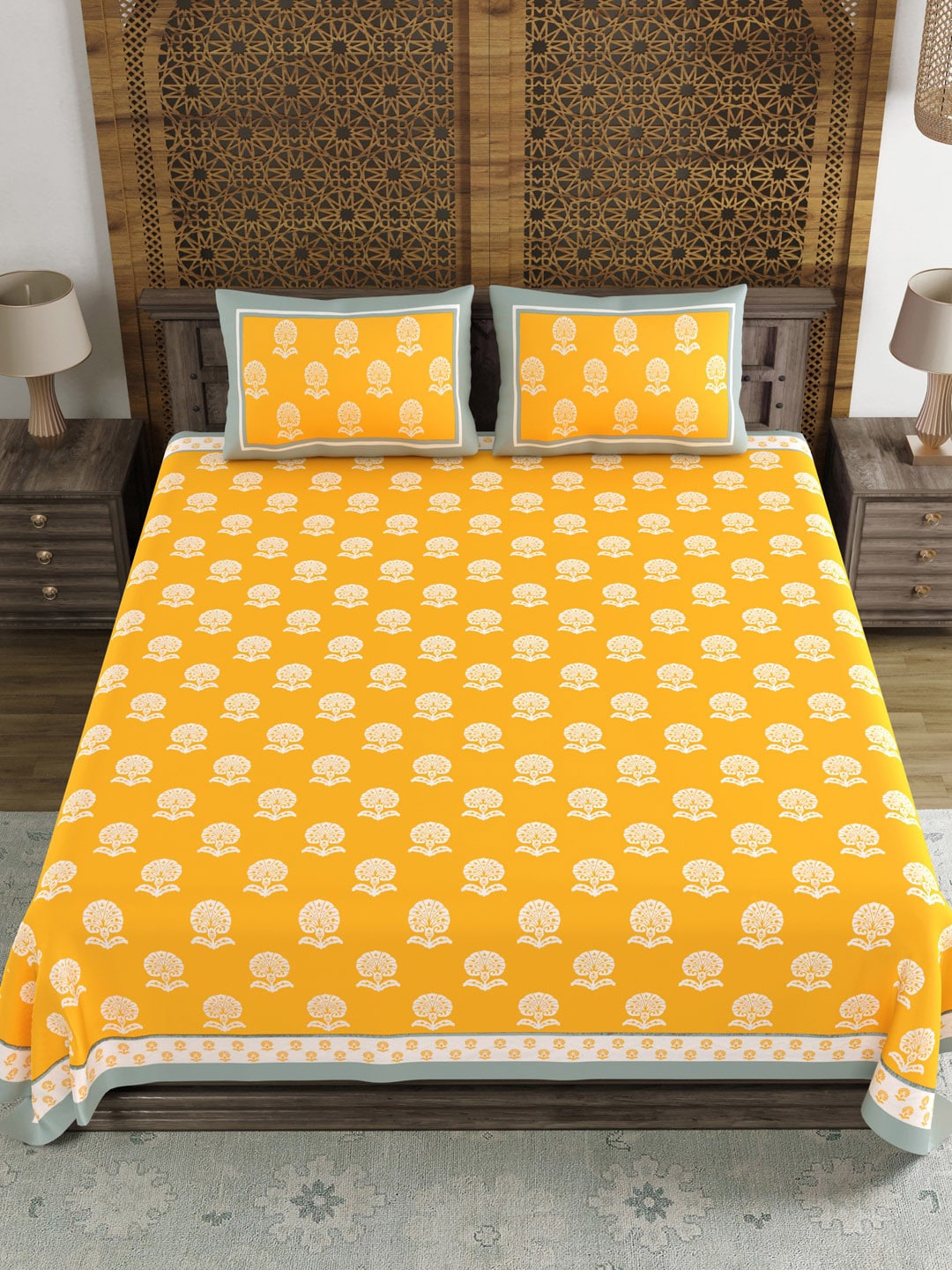 https://cdn.shopify.com/s/files/1/1857/6931/products/79e86124-c99f-4067-a411-8b46839531f01697107424798BLOCKSOFINDIAYellowWhiteEthnicMotifs210TCKingBedsheetwith2Pi2.jpg?v=1703241846