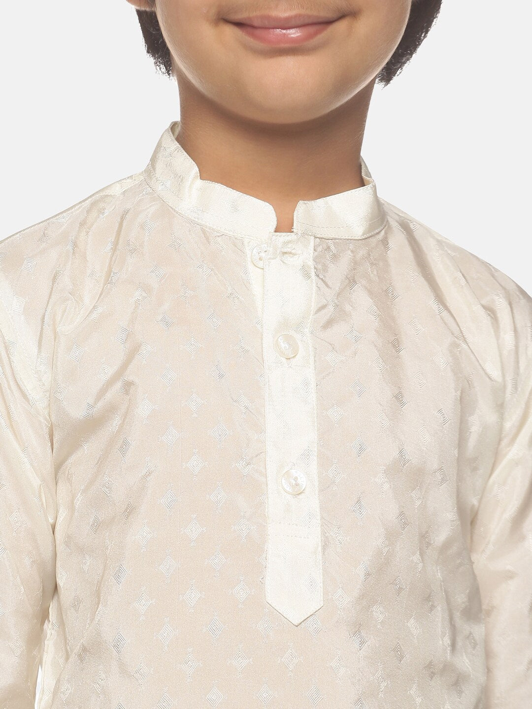 https://cdn.shopify.com/s/files/1/1857/6931/products/94173858-33e6-42a8-bbad-0d30afc7305b1646226943712SethukrishnaBoysCream-ColouredKurtawithPyjamas2.jpg?v=1661576221