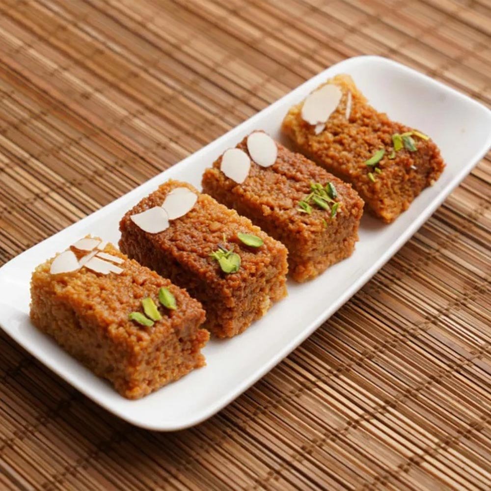 https://cdn.shopify.com/s/files/1/1857/6931/files/AgraSweetsAjmeriKalakand1-877152.jpg?v=1736144034