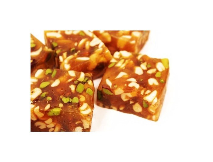 https://cdn.shopify.com/s/files/1/1857/6931/files/AshaSweetCenterDryFruitHalwa-175278.jpg?v=1736149509