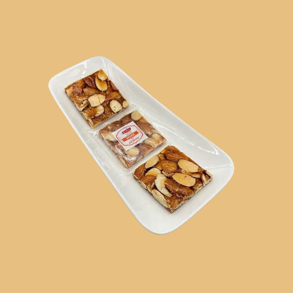https://cdn.shopify.com/s/files/1/1857/6931/files/BadamChikki.png?v=1784886931
