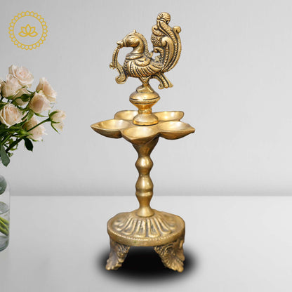 https://cdn.shopify.com/s/files/1/1857/6931/files/BrassPeacockOilWickDiyaMC00323.jpg?v=1762395178
