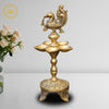https://cdn.shopify.com/s/files/1/1857/6931/files/BrassPeacockOilWickDiyaMC00323.jpg?v=1762395178