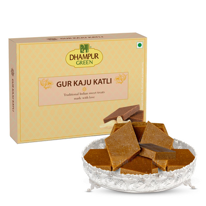 https://cdn.shopify.com/s/files/1/1857/6931/files/DhampurGreenGurKajuKatli.png?v=1762418132