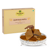 https://cdn.shopify.com/s/files/1/1857/6931/files/DhampurGreenGurKajuKatli.png?v=1762418132