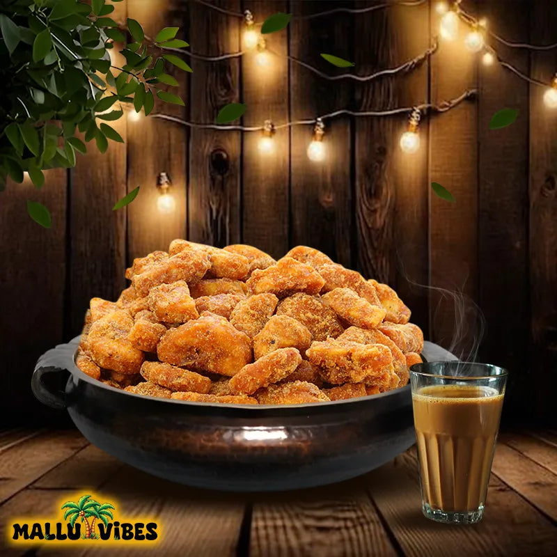 https://cdn.shopify.com/s/files/1/1857/6931/files/Front_view_of_Mallu_Vibes_Best_Kerala_snacks_online_sharkara_upperi_in_a_bowl_english_-_Authentic_Kerala_snacks_Jaggery_Coated_Banana_chips.webp?v=1746525724