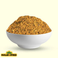 https://cdn.shopify.com/s/files/1/1857/6931/files/Front_view_of_Mallu_Vibes_Netholi_Chammanthi_Podi_with_Homemade_Fresh_and_No_Preservatives_a_tangy_and_spicy_flavor_english_-_anchovy_chutney_powder_chammanthi_podi_with_bowl.webp?v=1767007078