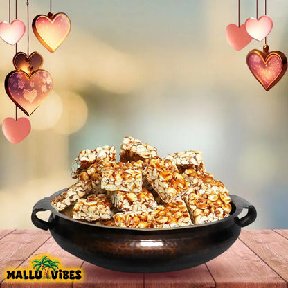 https://cdn.shopify.com/s/files/1/1857/6931/files/Front_view_of_Online_Kerala_snacks_kappilandi_mittai_in_a_bowl_english_-_Best_Kerala_snacks_online_peanut_jaggery_candy.webp?v=1746600015