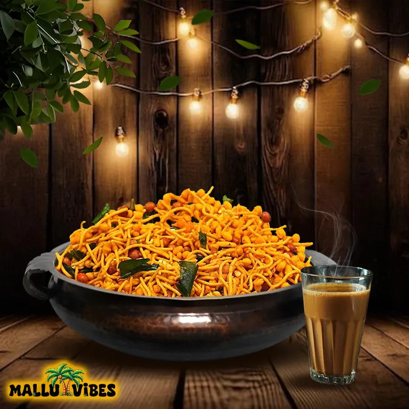 https://cdn.shopify.com/s/files/1/1857/6931/files/Front_view_of_crunchy_mixture_in_a_Mallu_Vibes_Organic_Kerala_snacks_malayalam_-_Kerala_snacks_chivada.webp?v=1746525787