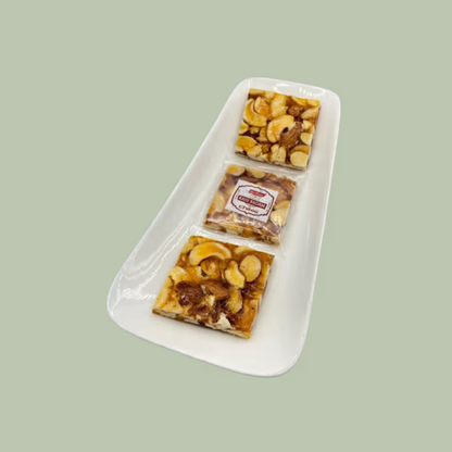 https://cdn.shopify.com/s/files/1/1857/6931/files/KajuChikki.png?v=1784886917