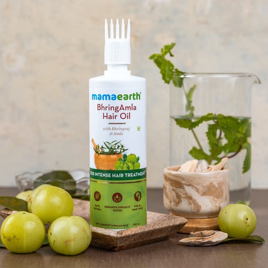 https://cdn.shopify.com/s/files/1/1857/6931/products/MamaearthBhringamlaHairOilForIntenseHairTreatment2.jpg?v=1709114352