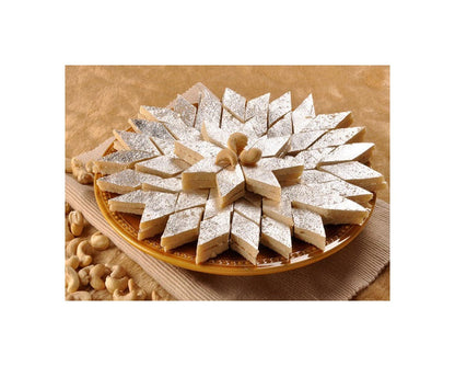 https://cdn.shopify.com/s/files/1/1857/6931/products/MithaiwalaKajuBurfi.jpg?v=1623475618