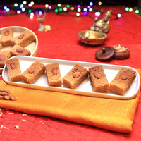 https://cdn.shopify.com/s/files/1/1857/6931/files/OliveMithaiAjmeerKalakand.jpg?v=1716892495