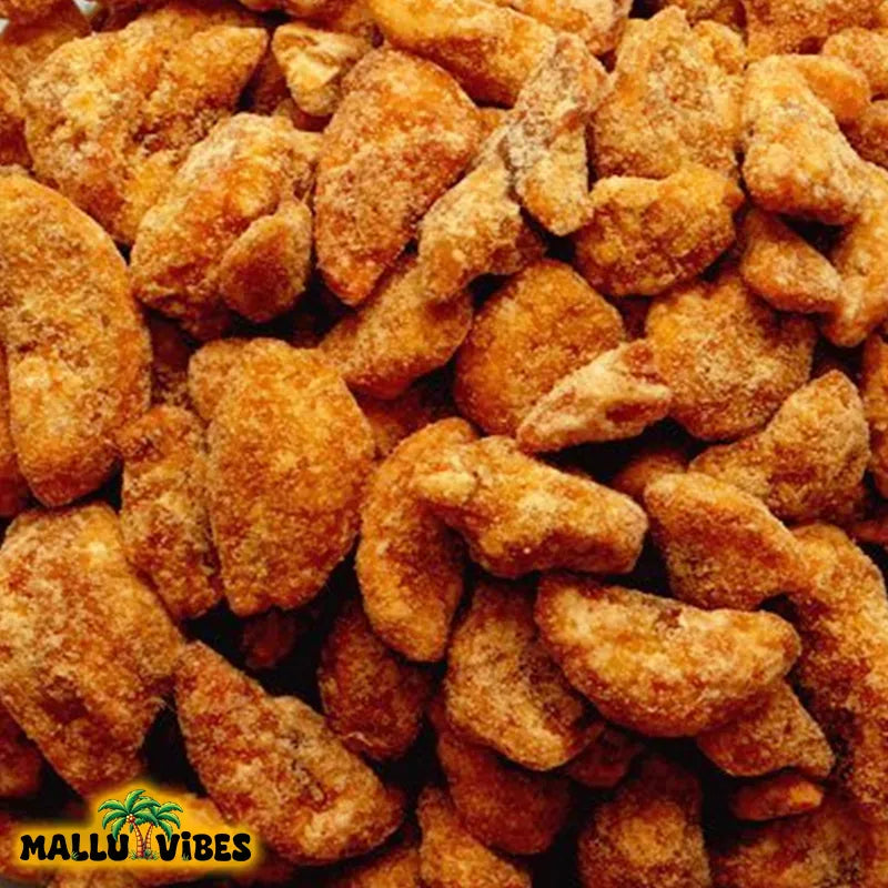 https://cdn.shopify.com/s/files/1/1857/6931/files/Top_View_of_Mallu_Vibes_Best_Kerala_snacks_online_sharkara_upperi_in_a_bowl_english_-_Authentic_Kerala_snacks_Jaggery_Coated_Banana_chips.webp?v=1767011758