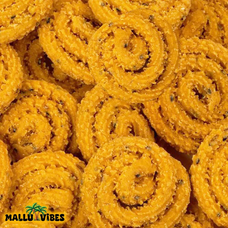 https://cdn.shopify.com/s/files/1/1857/6931/files/Top_view_of_Best_Kerala_snacks_online_arimurukku_in_a_bowl_english_-_Homemade_Kerala_snacks_crispy_rice_flour_spirals.webp?v=1767011061