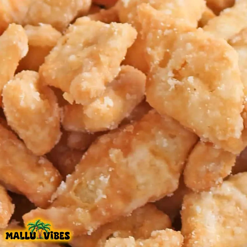 https://cdn.shopify.com/s/files/1/1857/6931/files/Top_view_of_Best_Kerala_snacks_online_diamond_chips_sweet_in_a_bowl_english_-_Organic_Kerala_snacks_sugar_coated_diamond_sweet_cuts.webp?v=1767007970