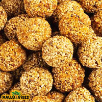 https://cdn.shopify.com/s/files/1/1857/6931/files/Top_view_of_Homemade_Kerala_snacks_Ellunda_in_a_bowl_english_-_Best_Kerala_snacks_online_Ellunda_Sesame_jaggery_balls.webp?v=1767007517