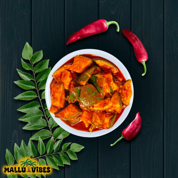 https://cdn.shopify.com/s/files/1/1857/6931/files/Top_view_of_Mallu_Vibes_Homemade_Kerala_pickles_and_No_Preservatives_Mango_pickle_with_chunks_of_ripe_mangoes_malayalam_-_manga_achar.webp?v=1746527009