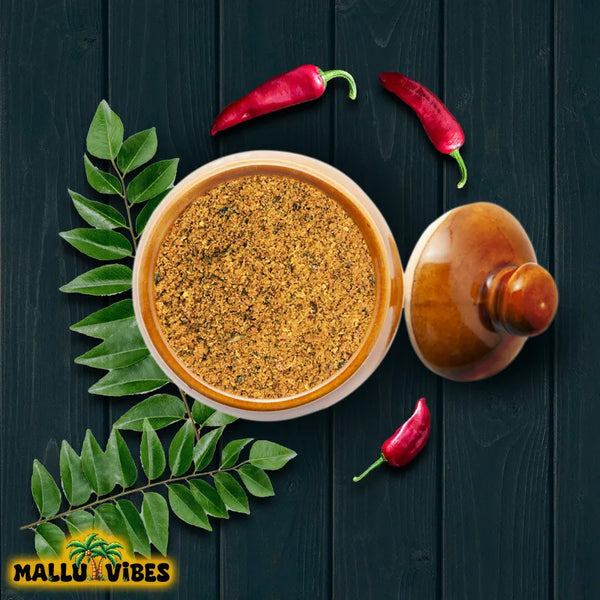 https://cdn.shopify.com/s/files/1/1857/6931/files/Top_view_of_Mallu_Vibes_Netholi_Chammanthi_Podi_with_Homemade_Fresh_and_No_Preservatives_a_tangy_and_spicy_flavor_english_-_anchovy_chutney_powder_chammanthi_podi.webp?v=1746600217