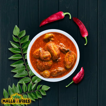 https://cdn.shopify.com/s/files/1/1857/6931/files/Top_view_of_Mallu_Vibes_Tender_mango_Kerala_pickles_with_aromatic_spices_Homemade_Kerala_pickles_and_No_Preservatives_malayalam_-_kanni_manga_achar.webp?v=1746527509