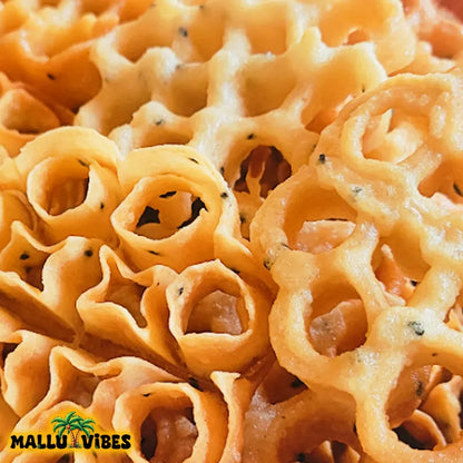 https://cdn.shopify.com/s/files/1/1857/6931/files/Top_view_of_Mallu_Vibes_Traditional_Kerala_food_Achappam_in_a_bowl_english_-_Homemade_Kerala_snacks_Achappam_kerala_rose_cookies_Indian_snacks.webp?v=1746526444