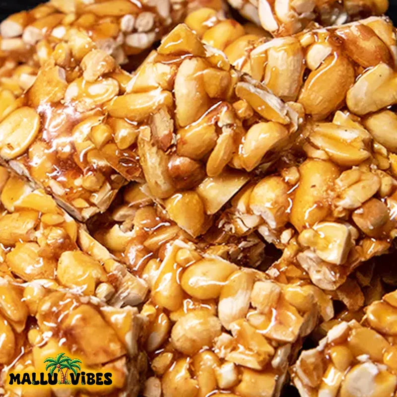 https://cdn.shopify.com/s/files/1/1857/6931/files/Top_view_of_Online_Kerala_snacks_kappilandi_mittai_in_a_bowl_english_-_Best_Kerala_snacks_online_peanut_jaggery_candy.webp?v=1767007393