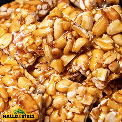 https://cdn.shopify.com/s/files/1/1857/6931/files/Top_view_of_Online_Kerala_snacks_kappilandi_mittai_in_a_bowl_english_-_Best_Kerala_snacks_online_peanut_jaggery_candy.webp?v=1767007393