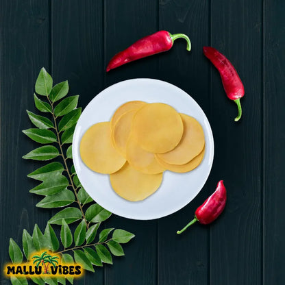 https://cdn.shopify.com/s/files/1/1857/6931/files/Top_view_of_papad_with_white_plate.webp?v=1746702493