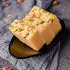 https://cdn.shopify.com/s/files/1/1857/6931/files/VellankiFoods-ButterBurfi.jpg?v=1716901722