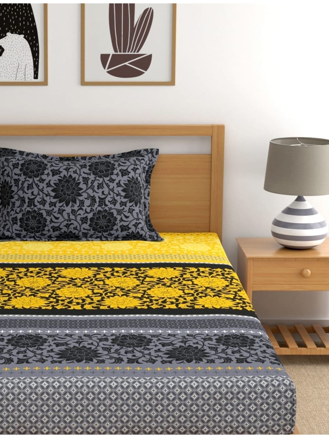 https://cdn.shopify.com/s/files/1/1857/6931/products/a118b77d-07d3-430e-81a2-faa0a532a4251694485508711DreamscapeYellowBlackEthnicMotifs140TCSingleBedsheetwith1Pil3.jpg?v=1703241843