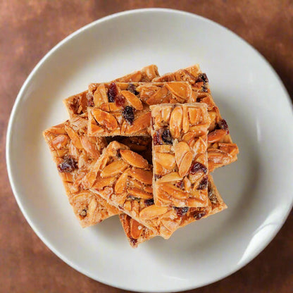 https://cdn.shopify.com/s/files/1/1857/6931/files/almond-cranberry-chew-2492556.jpg?v=1762168705