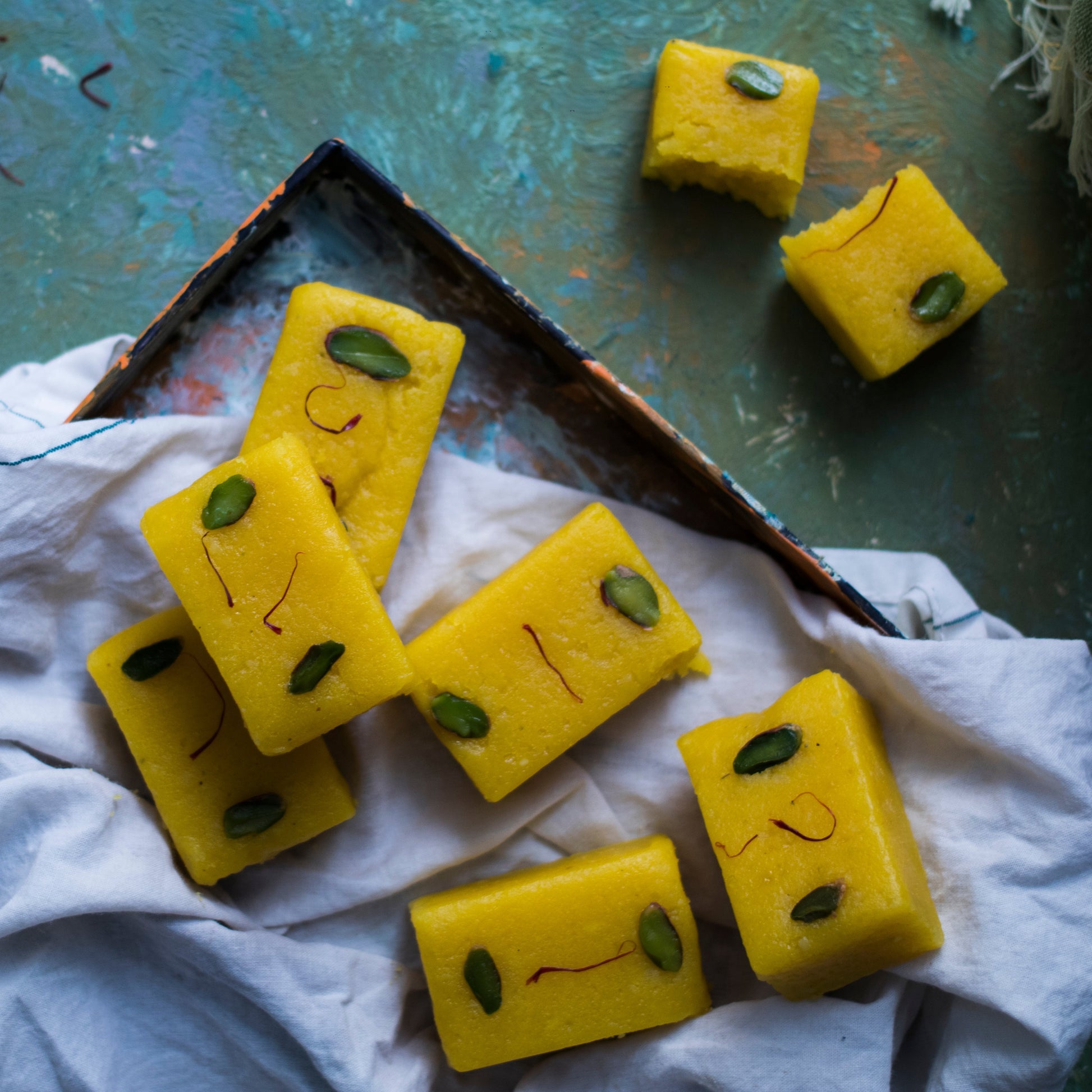 https://cdn.shopify.com/s/files/1/1857/6931/files/badambarfi.jpg?v=1765200220