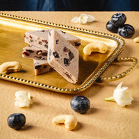 https://cdn.shopify.com/s/files/1/1857/6931/files/blueberry-kaju-katli-169338.jpg?v=1762169058