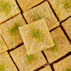 https://cdn.shopify.com/s/files/1/1857/6931/files/cashew-kunafa-delight-4957872.jpg?v=1762169151