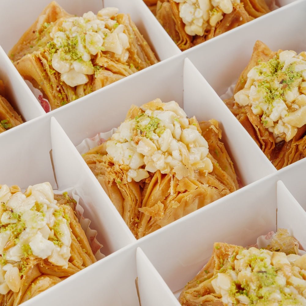 https://cdn.shopify.com/s/files/1/1857/6931/files/cashew-pyramid-baklava-9484643.jpg?v=1762169194