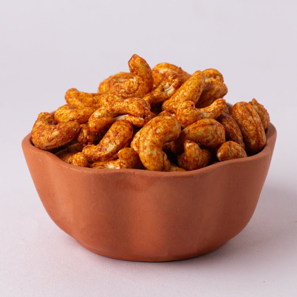 https://cdn.shopify.com/s/files/1/1857/6931/files/dry-roasted-sriracha-cashew-517341.jpg?v=1762169086